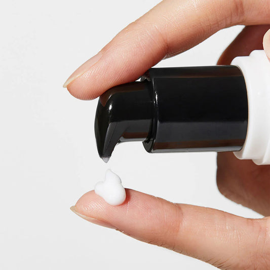 Pump dispenser of COSRX Snail Peptide Eye Cream showing lightweight white cream texture