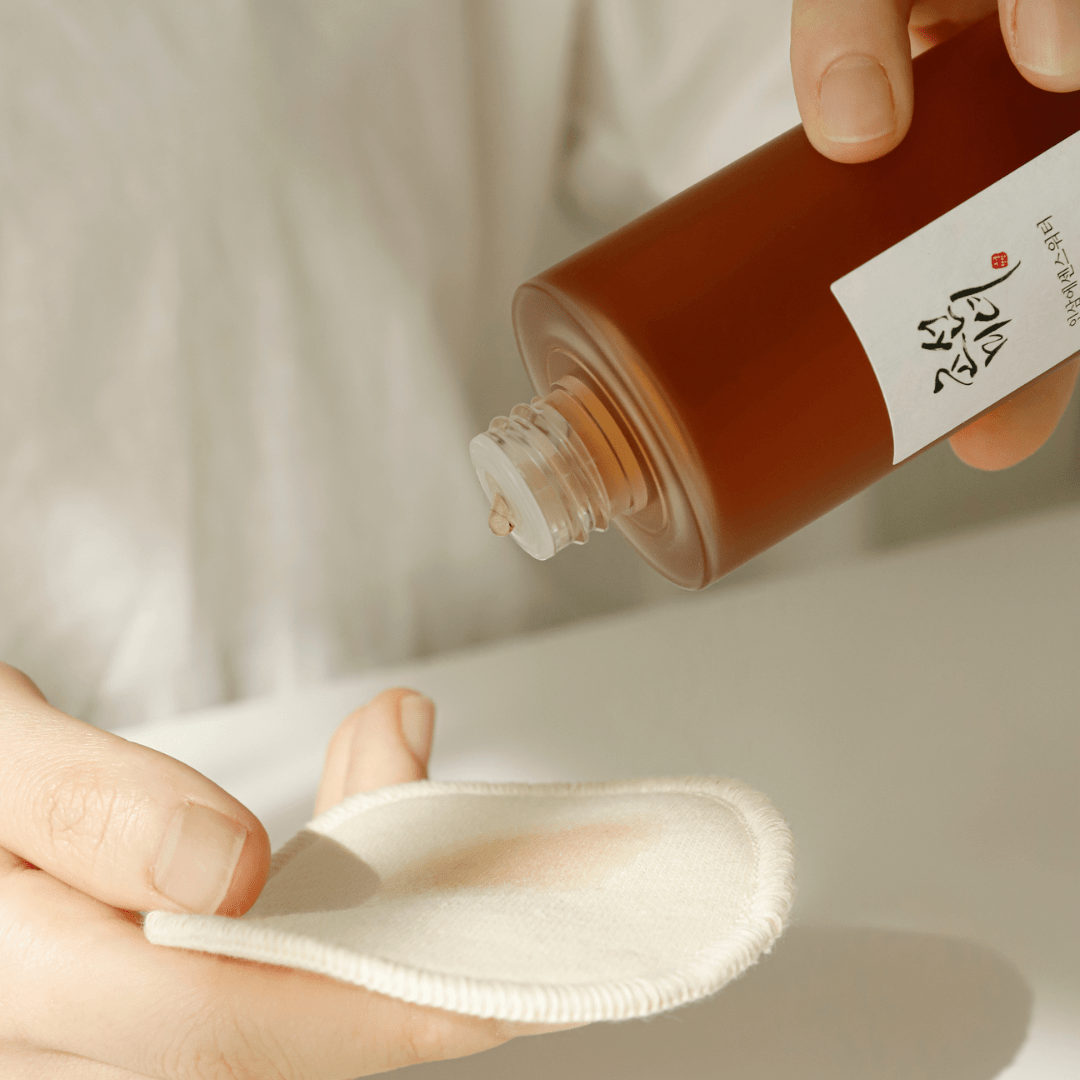 Application of Beauty of Joseon Ginseng Essence Water onto cotton pad – nourishing Korean essence.