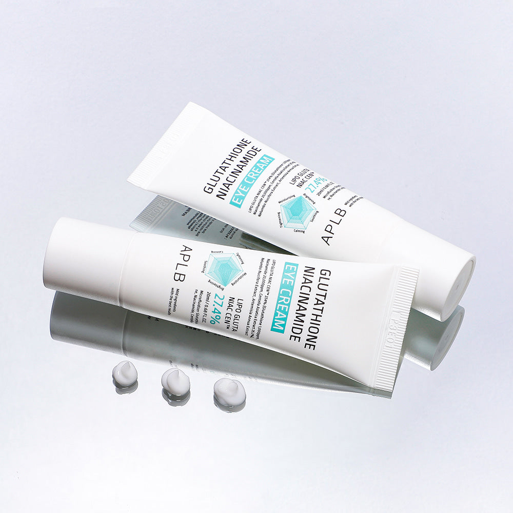 APLB Glutathione Niacinamide Eye Cream shown on a mirrored surface with cream drops, a brightening Korean eye cream for tired under-eyes, dark circles and smooth hydrated skin.