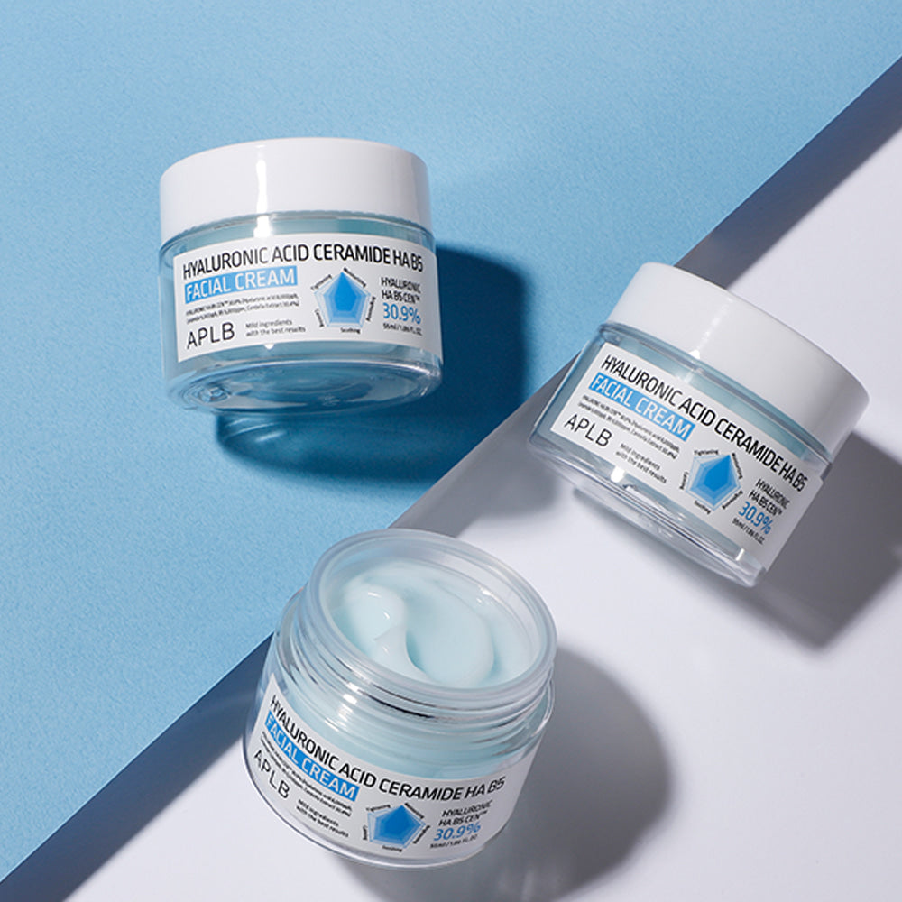 Open jar of APLB Hyaluronic Acid Ceramide HA B5 Facial Cream showing its blue cream texture